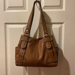Tignanello leather Brown medium shoulder Bag with gold tone hardwares.